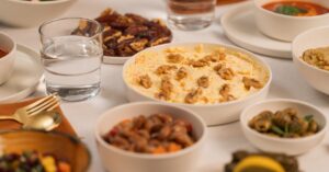 A table set for Iftar featuring an assortment of traditional dishes and drinks, perfect for Ramadan.